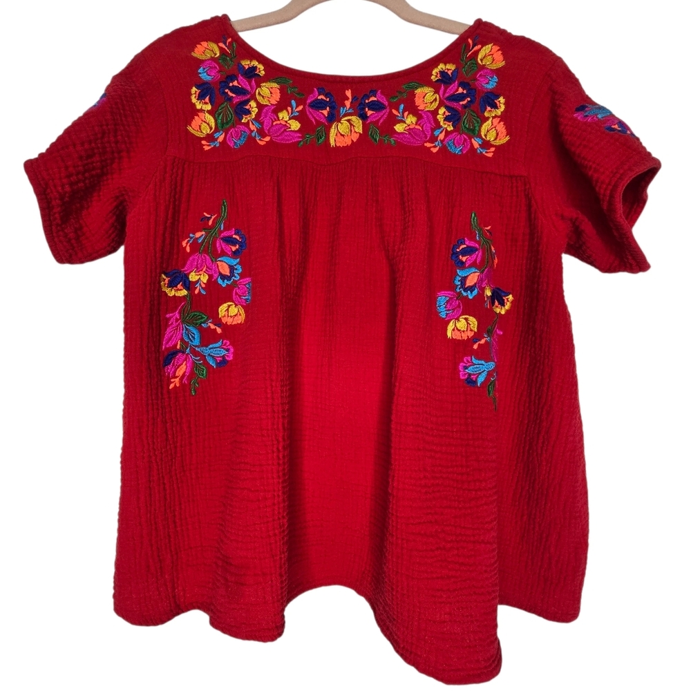 See and Be Seen red embroidered top featuring a colorful floral design on the